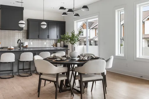 a dining room with furniture and window