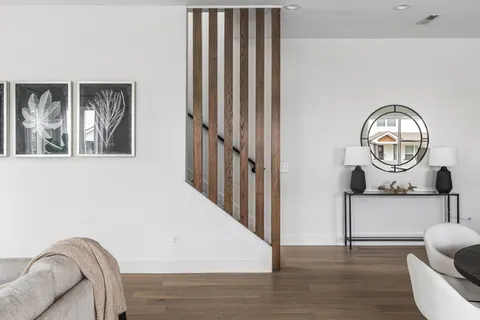 a view of a livingroom with furniture and wooden floor