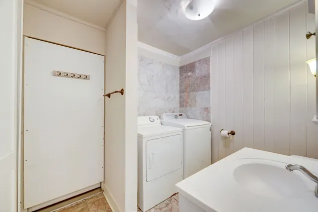 a utility room with dryer and washer