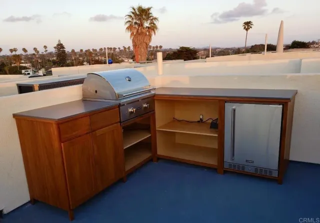 a view of a room with water heater and a table