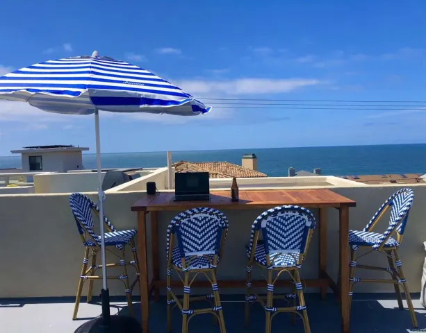 a view of a dining table and chairs in the patio