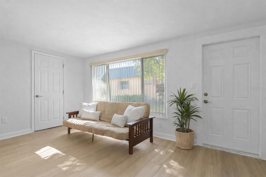 4409 Summersun Drive New Port Richey, FL 34652 - Photo 12 of 23 a living room with furniture potted plant and window