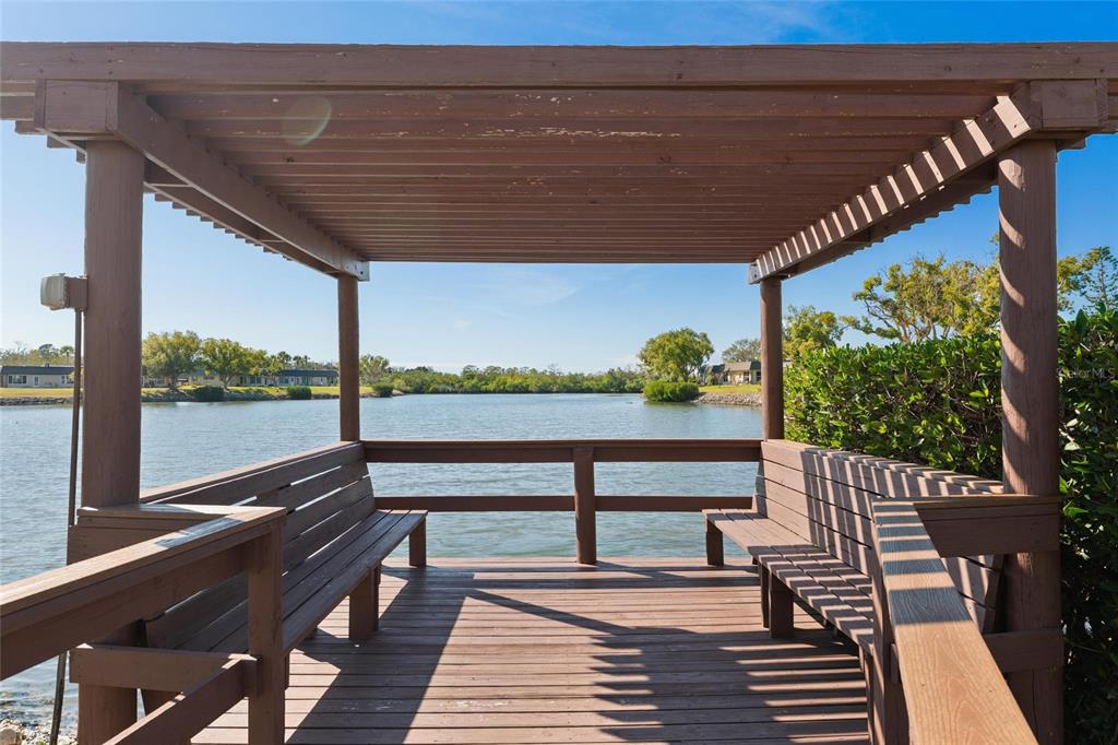 4409 Summersun Drive New Port Richey, FL 34652 - Photo 20 of 23 a balcony with wooden floor table and chairs