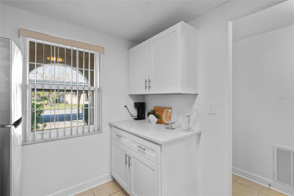 4409 Summersun Drive New Port Richey, FL 34652 - Photo 4 of 23 a view of a kitchen cabinets and a window