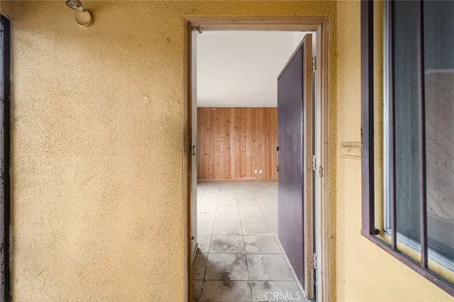 a view of a bathroom from a corridor