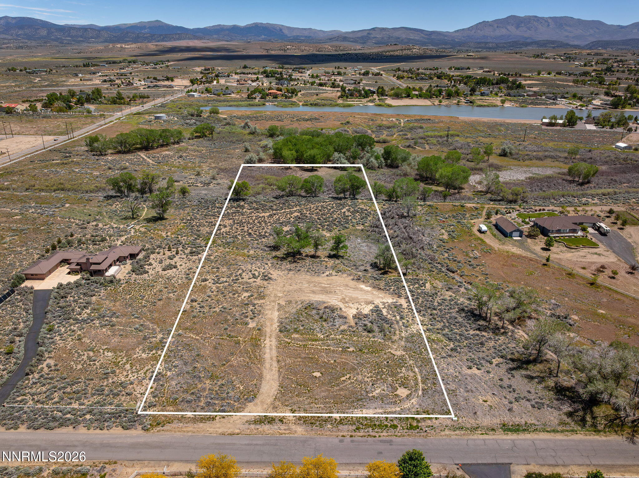 1655 Lombardy Road Gardnerville, NV 89410 - Photo 1 of 12 a view of a backyard with mountain view