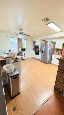a view of a kitchen with furniture and a kitchen