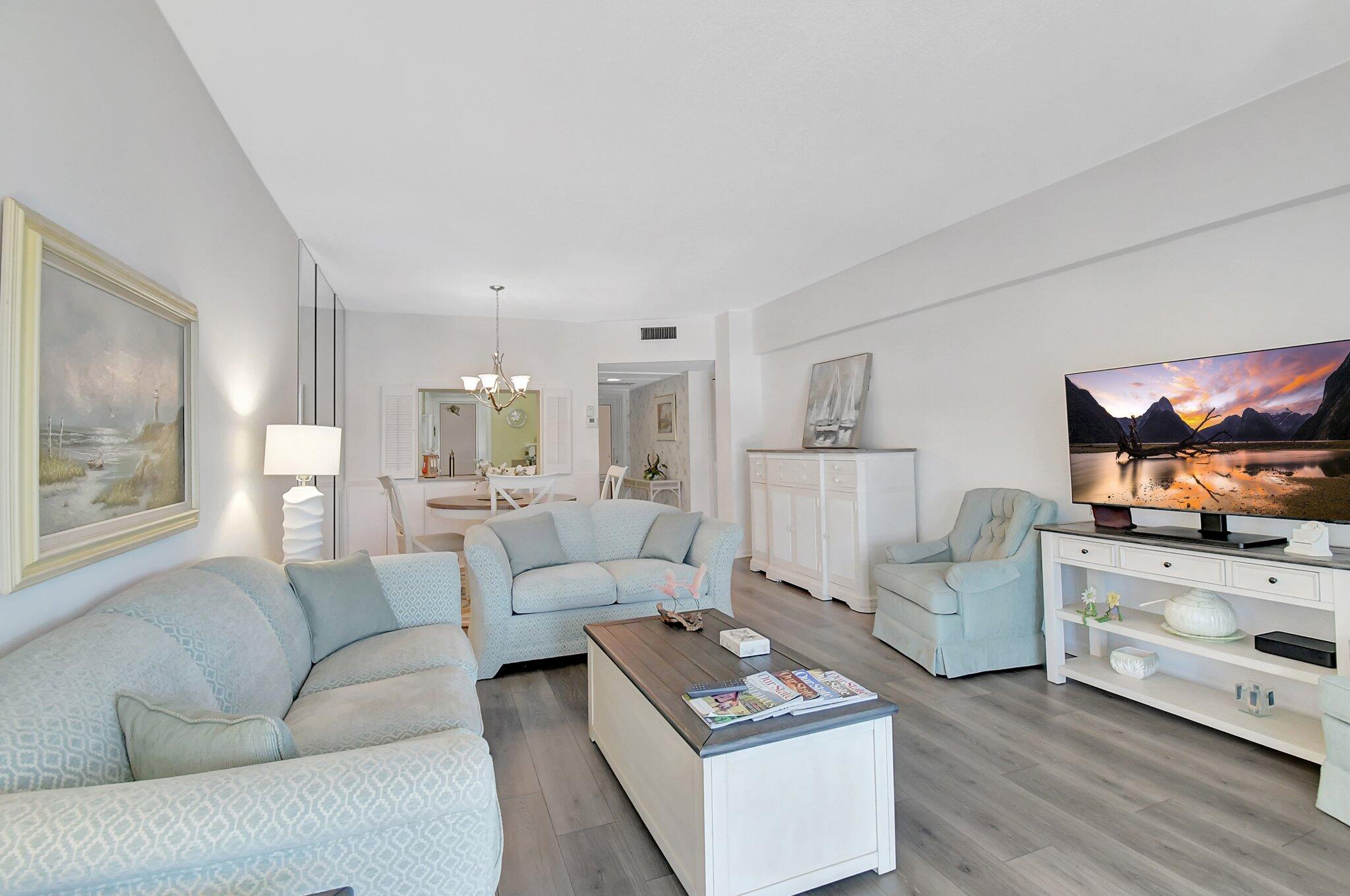1481 South Ocean Boulevard, Unit 413A Lauderdale-by-the-Sea, FL 33062 - Photo 14 of 48 a living room with furniture and a flat screen tv