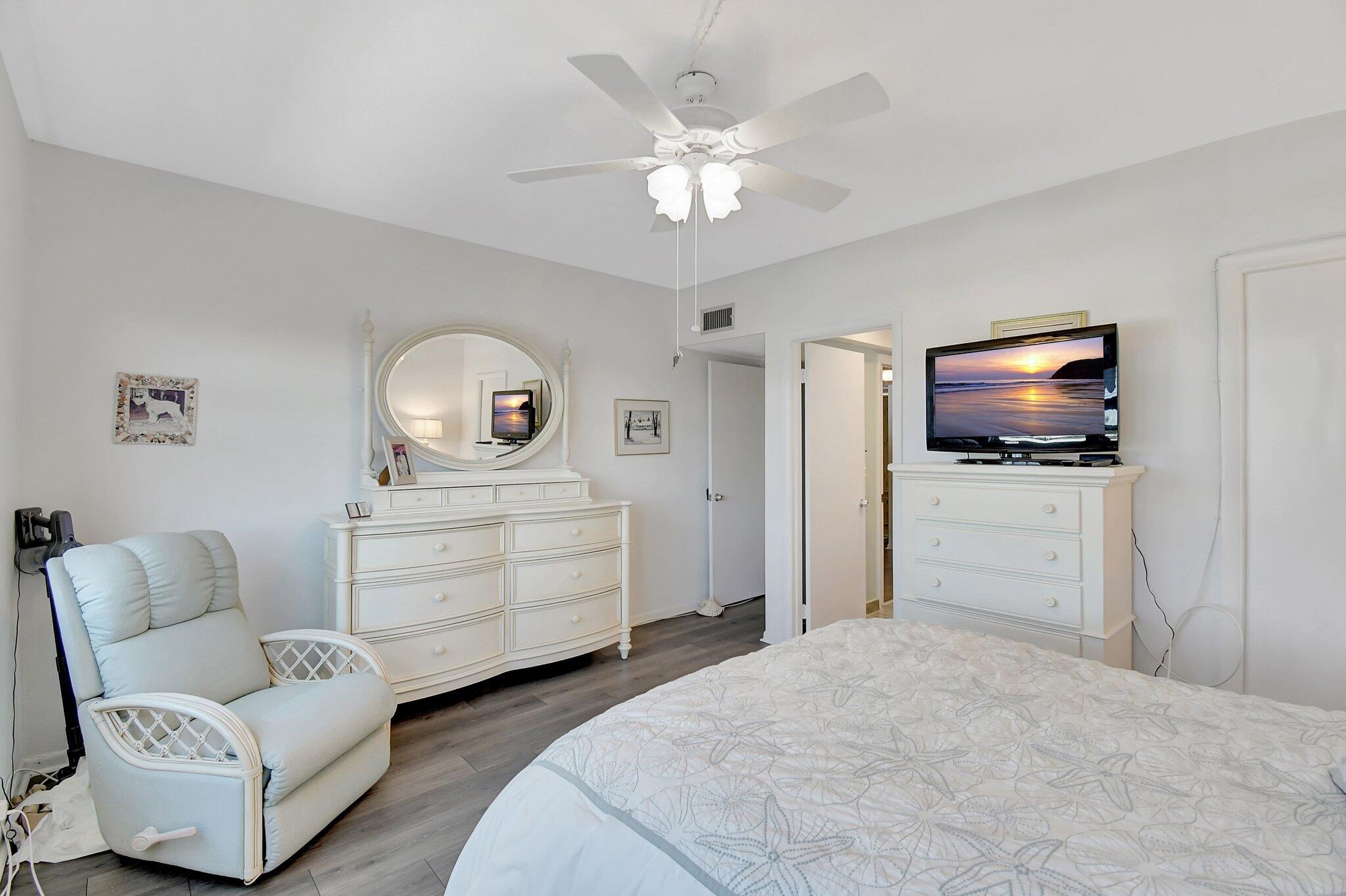 1481 South Ocean Boulevard, Unit 413A Lauderdale-by-the-Sea, FL 33062 - Photo 20 of 48 a bedroom with a bed and a television