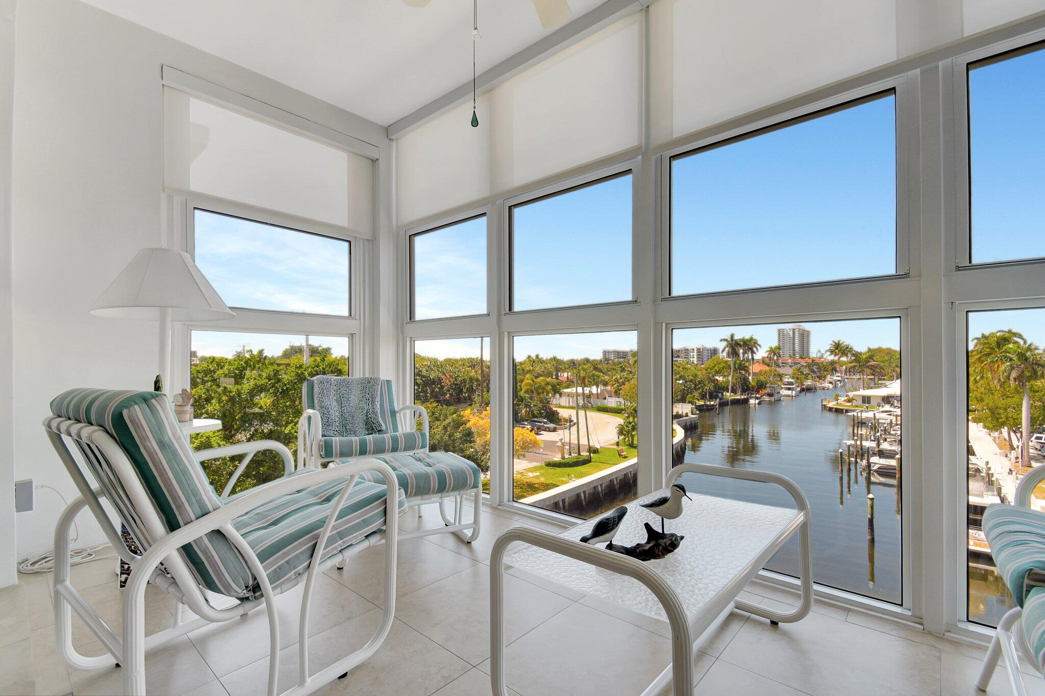 1481 South Ocean Boulevard, Unit 413A Lauderdale-by-the-Sea, FL 33062 - Photo 2 of 48 a view of a living room with furniture and floor to ceiling window