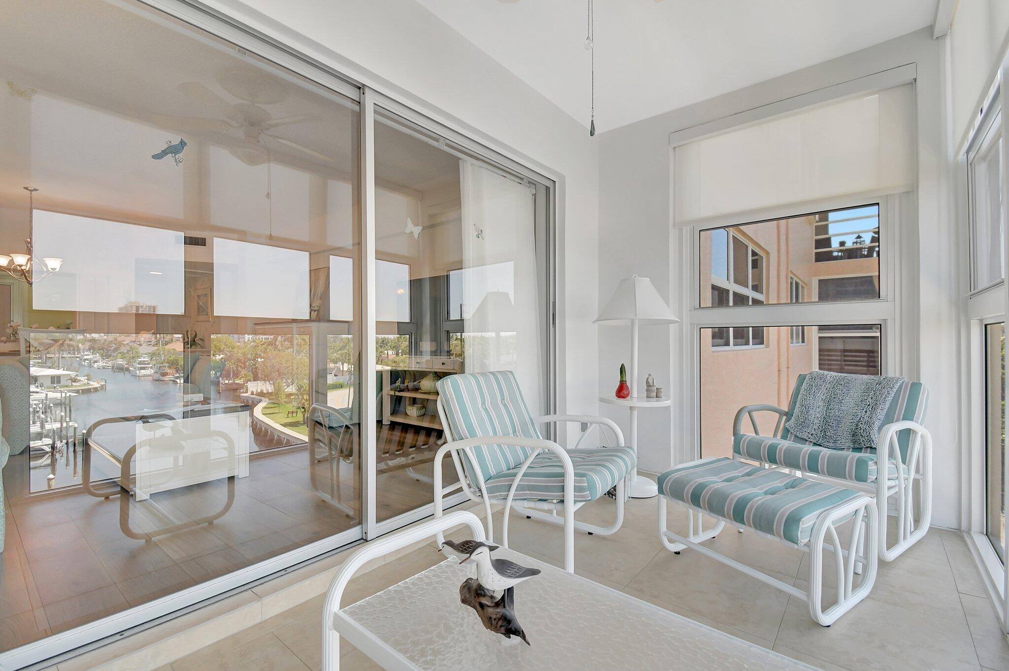 1481 South Ocean Boulevard, Unit 413A Lauderdale-by-the-Sea, FL 33062 - Photo 27 of 48 a living room with furniture and a floor to ceiling window