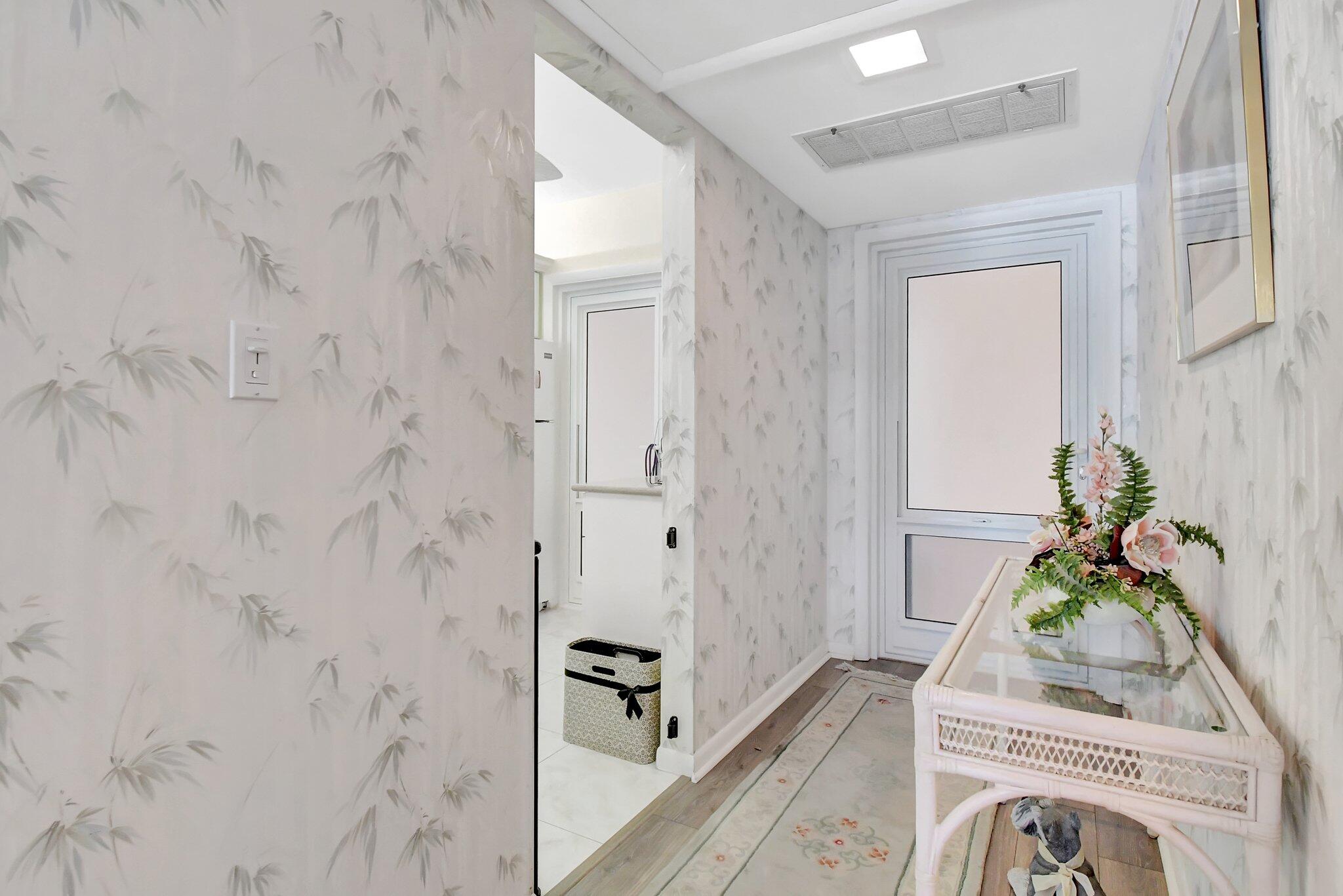 1481 South Ocean Boulevard, Unit 413A Lauderdale-by-the-Sea, FL 33062 - Photo 3 of 48 a room with a potted plant