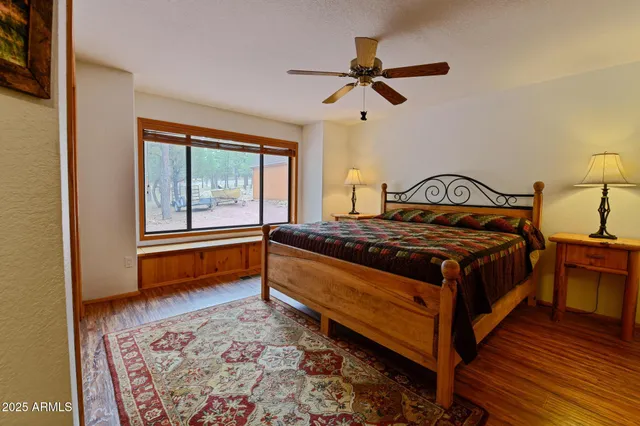 a bedroom with a bed and window