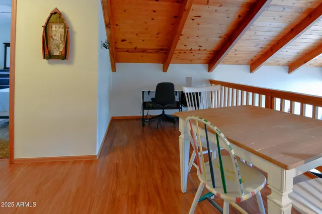 a view of a porch with wooden floor