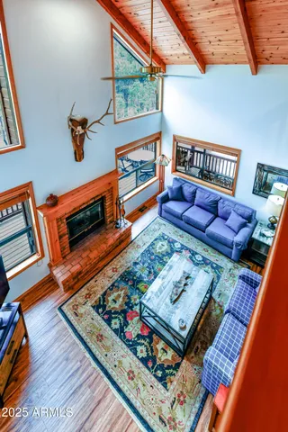 a living room with furniture and a rug