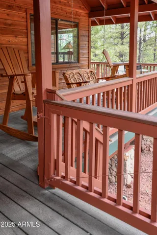a view of a porch with wooden floor