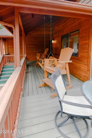 a view of a patio with a table and chairs