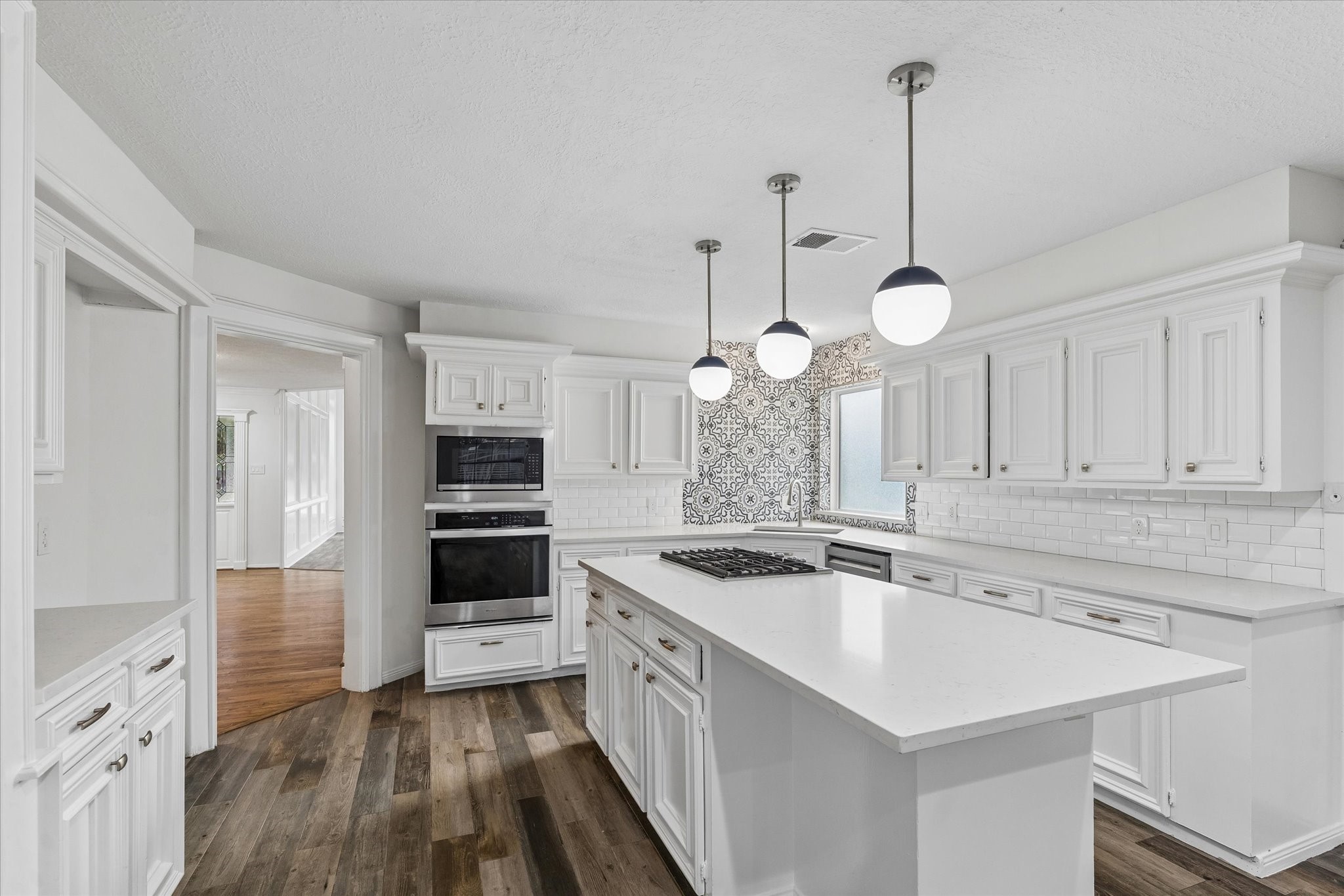 17902 Fernbluff Drive Spring, TX 77379 - Photo 11 of 29 a kitchen that has a sink a stove and cabinets