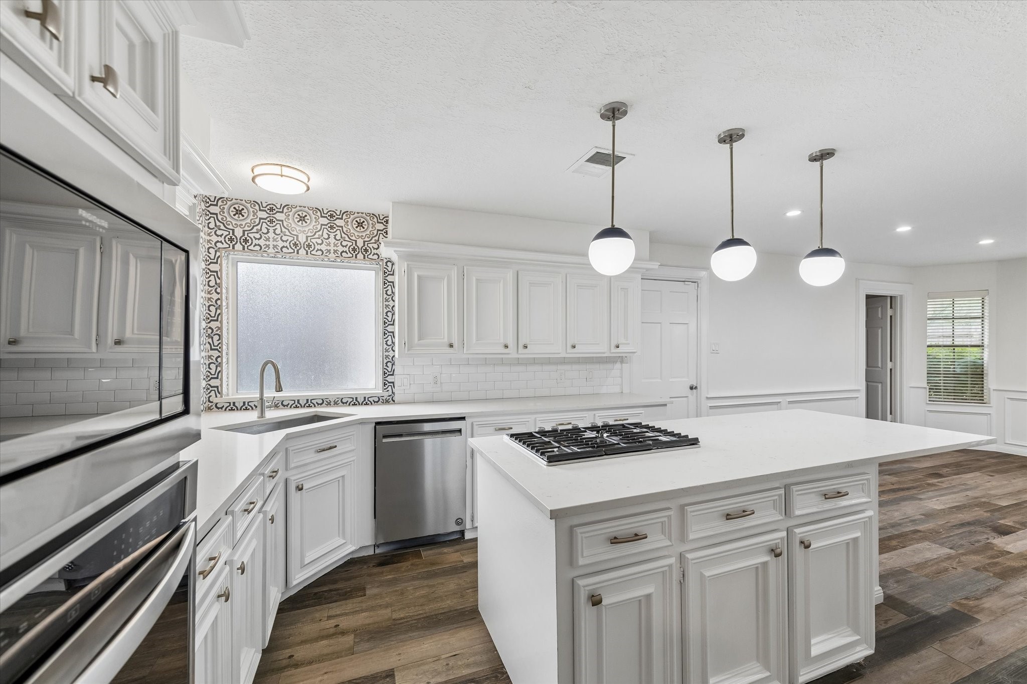 17902 Fernbluff Drive Spring, TX 77379 - Photo 13 of 29 a kitchen with cabinets and stainless steel appliances