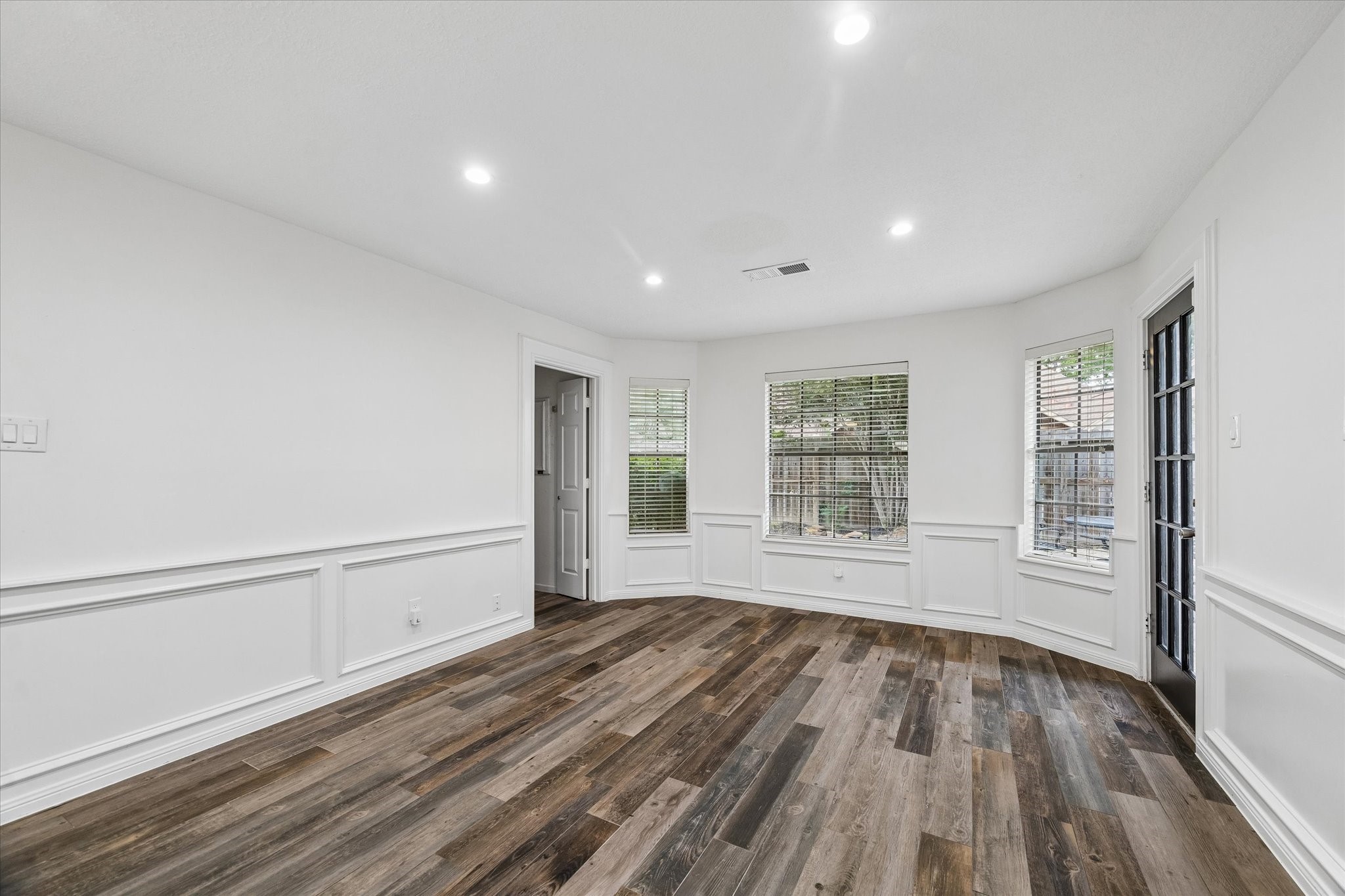 17902 Fernbluff Drive Spring, TX 77379 - Photo 14 of 29 a view of an empty room with wooden floor and a window