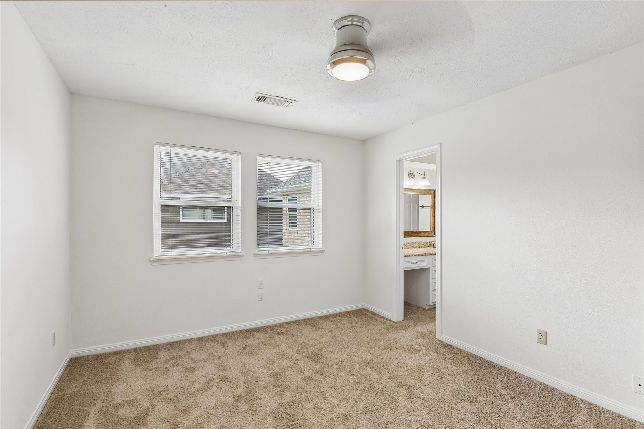 17902 Fernbluff Drive Spring, TX 77379 - Photo 18 of 29 an empty room with windows