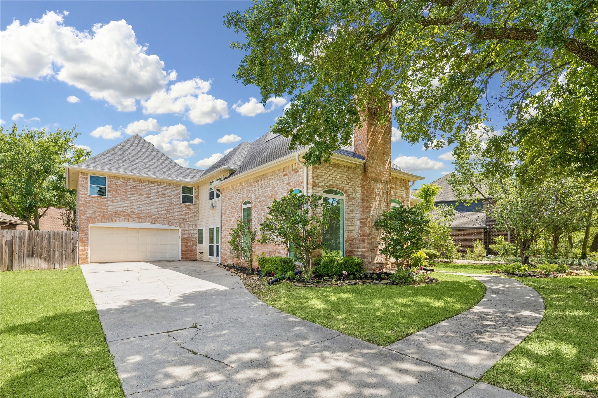 17902 Fernbluff Drive Spring, TX 77379 - Photo 2 of 29 a front view of a house with garden