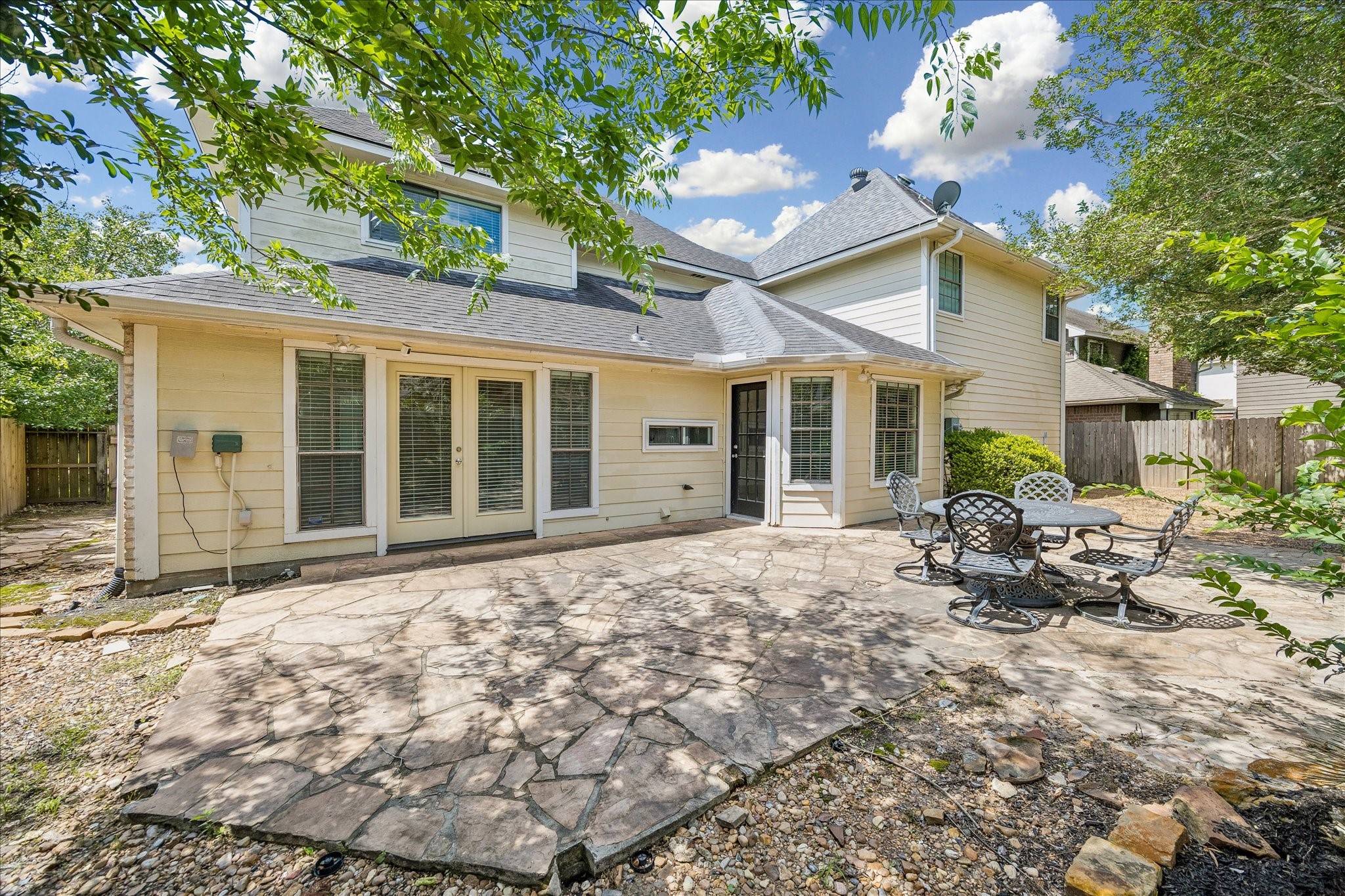 17902 Fernbluff Drive Spring, TX 77379 - Photo 28 of 29 a view of a house with backyard sitting area and porch
