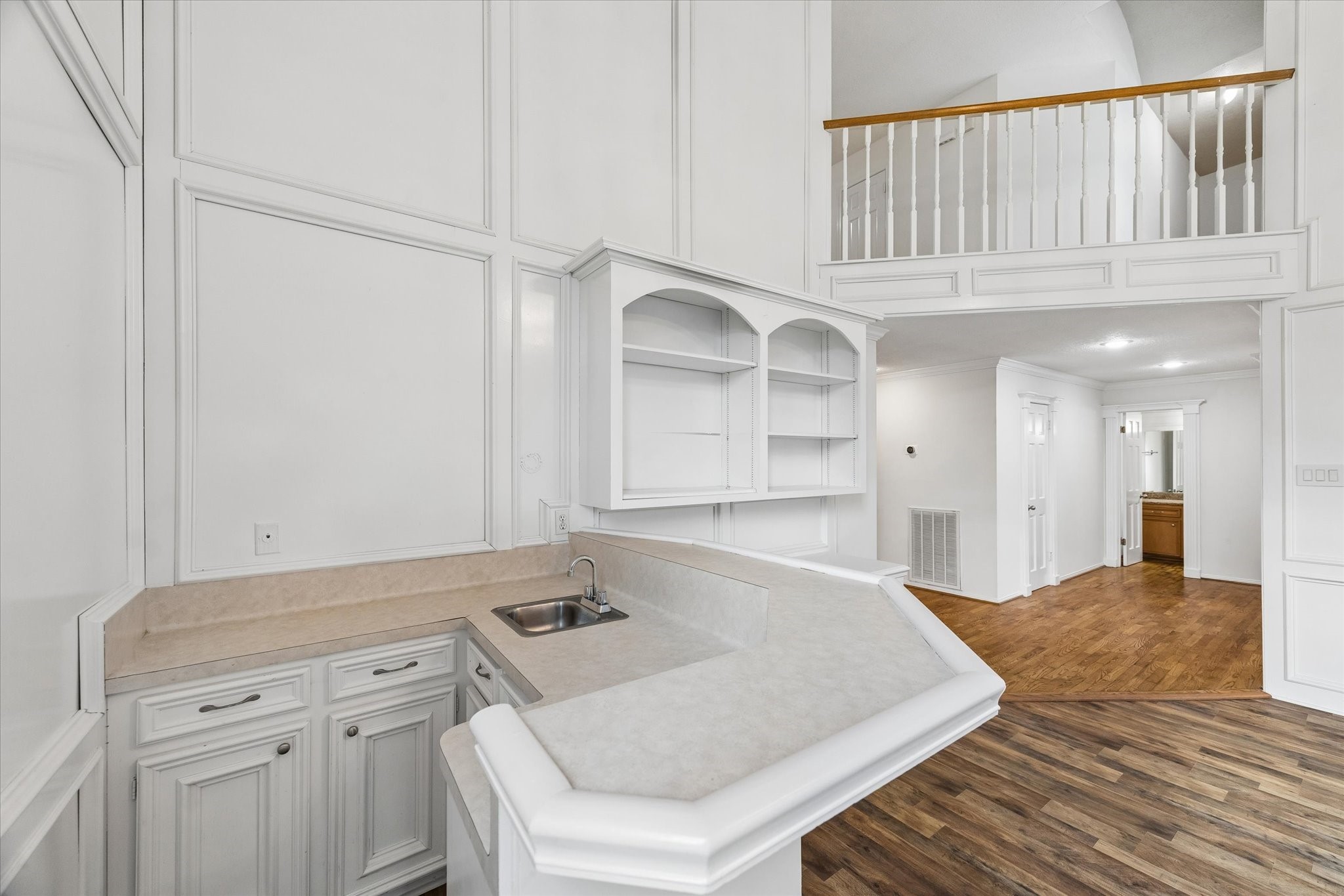 17902 Fernbluff Drive Spring, TX 77379 - Photo 7 of 29 a kitchen with white cabinets and wooden floor