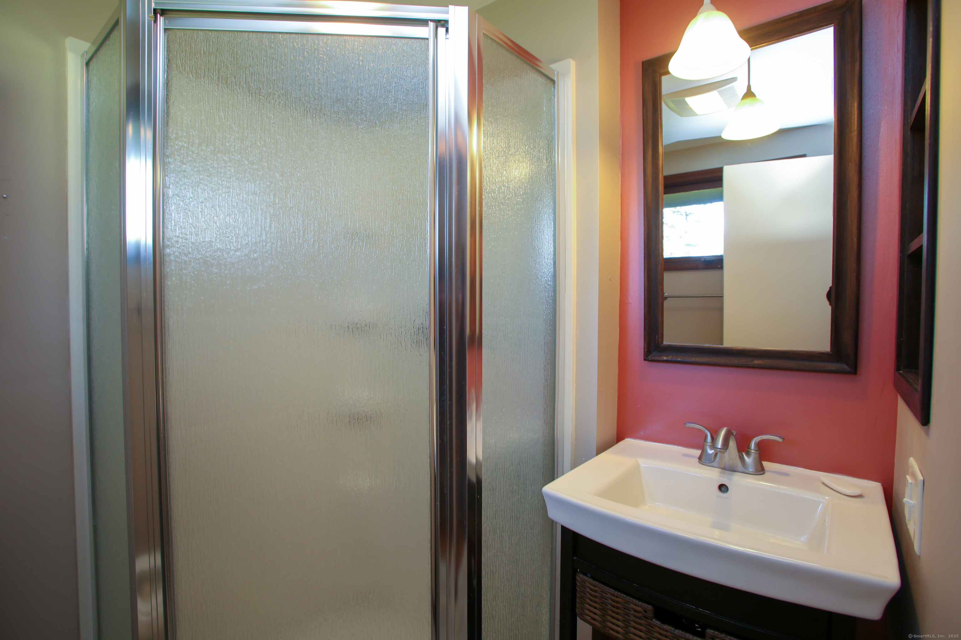 118 Washinee Heights Road Salisbury, CT 06068 - Photo 11 of 31 a bathroom with a sink and a mirror