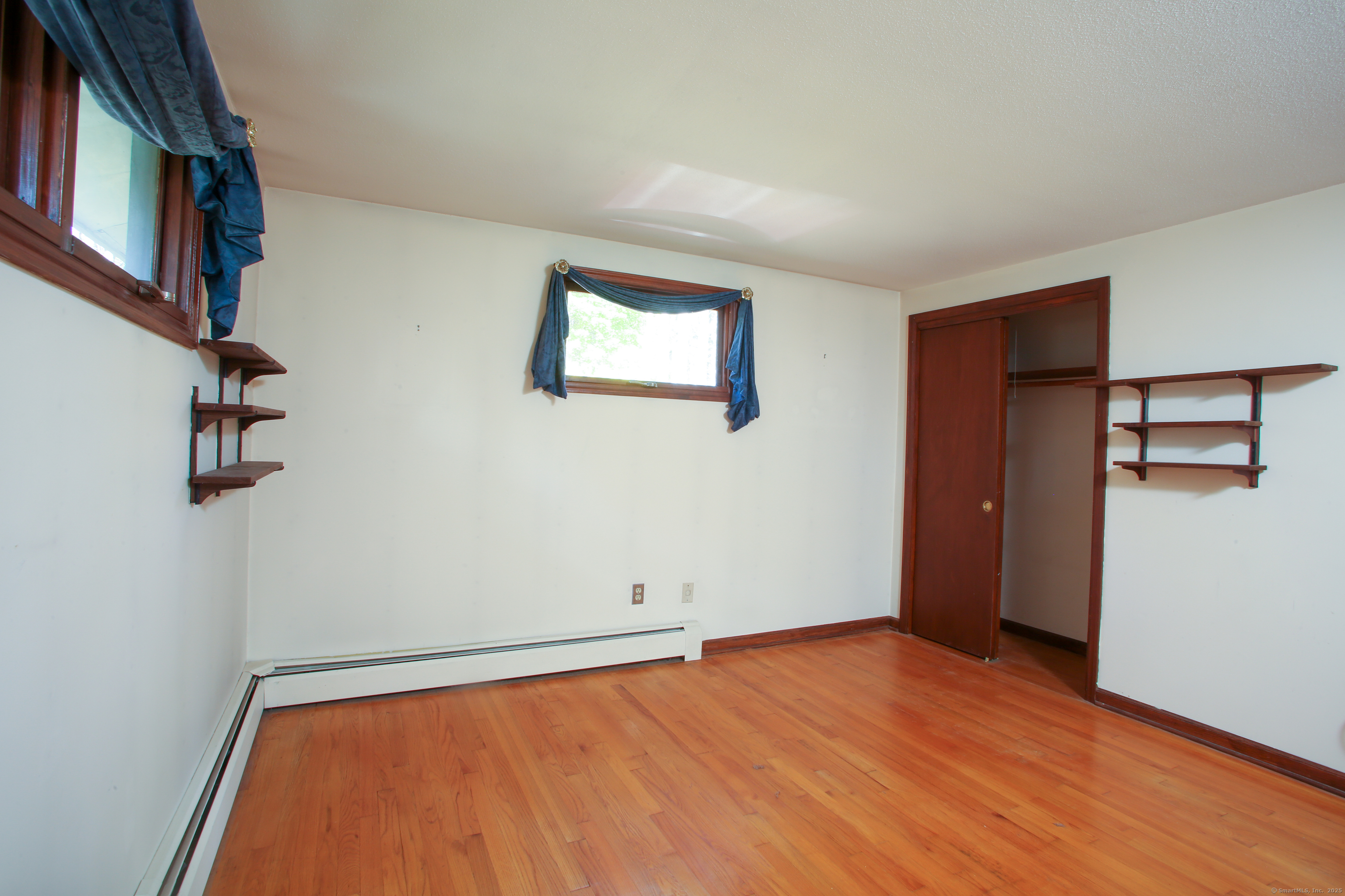 118 Washinee Heights Road Salisbury, CT 06068 - Photo 12 of 31 a view of an empty room with wooden floor and a window