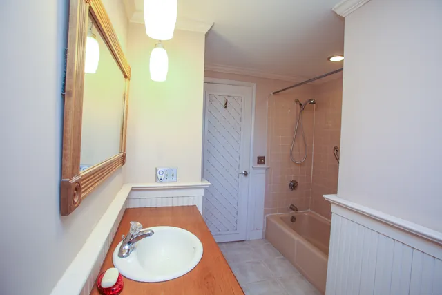 a bathroom with a toilet a sink and a bathtub