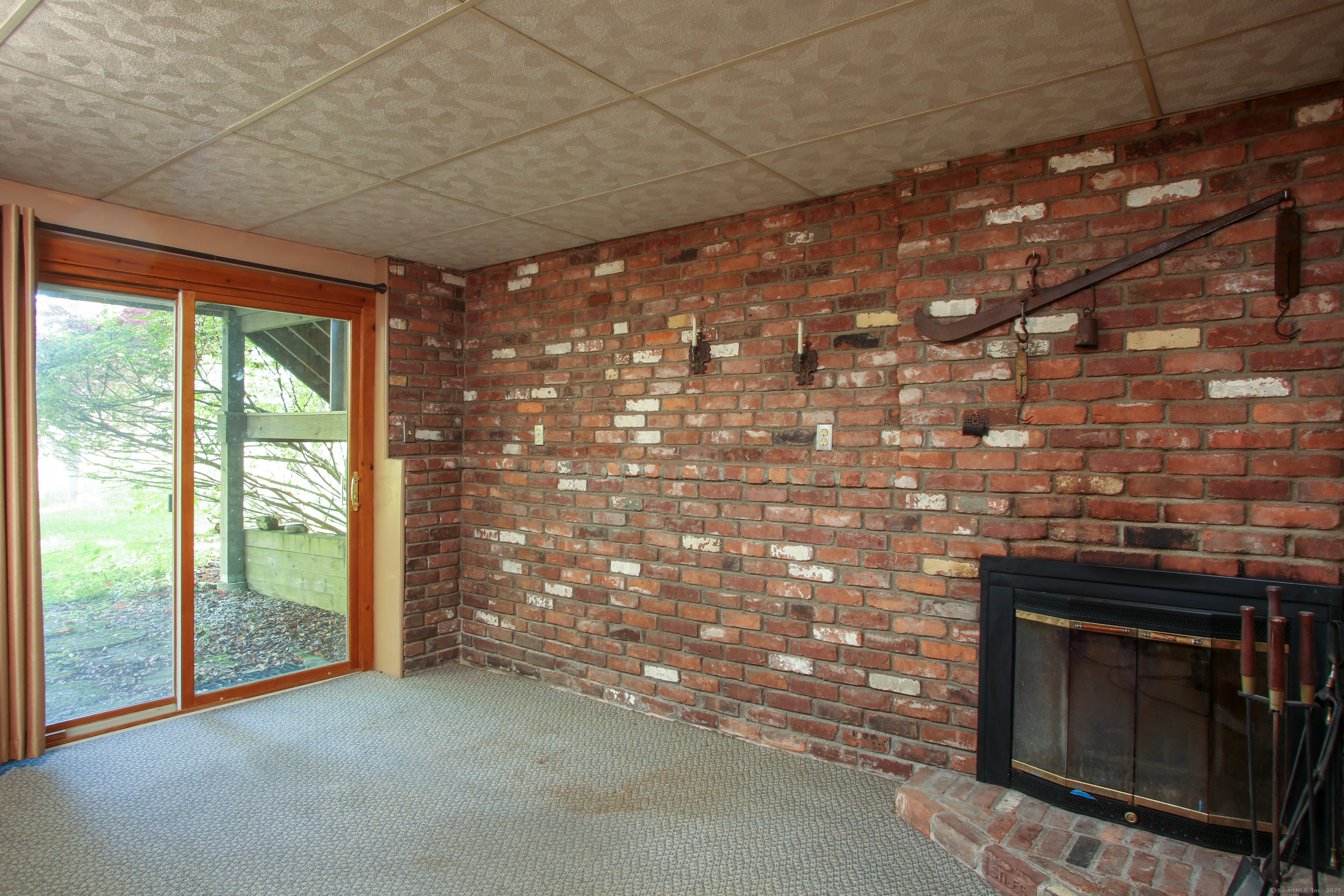 118 Washinee Heights Road Salisbury, CT 06068 - Photo 15 of 31 a view of empty room with floor to ceiling window and fireplace