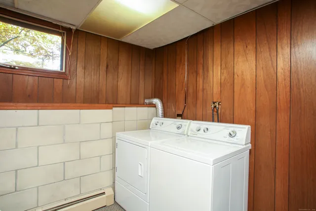 a view of a large trees with wooden fence
