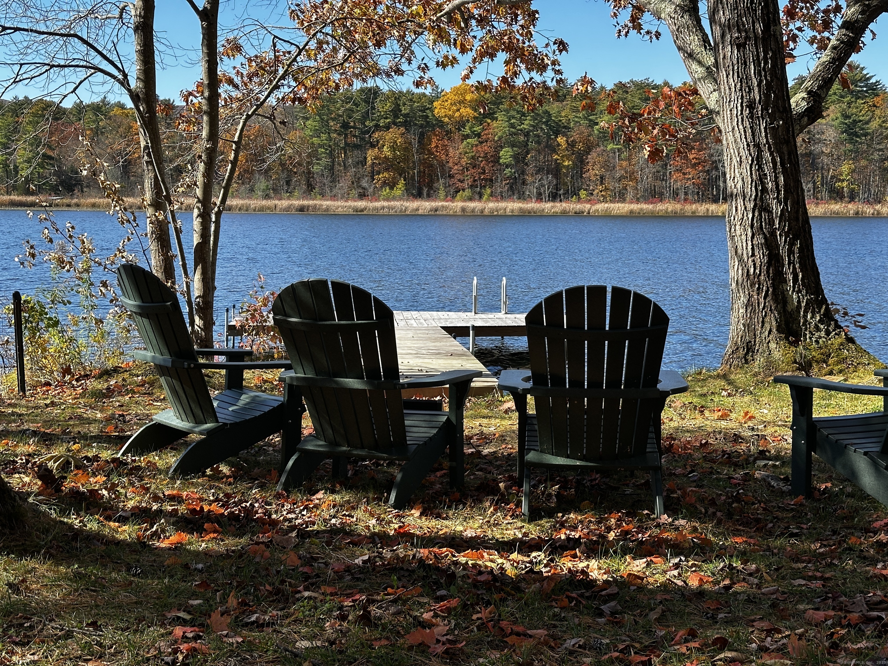 118 Washinee Heights Road Salisbury, CT 06068 - Photo 30 of 31 a couple of chairs that are sitting in a backyard