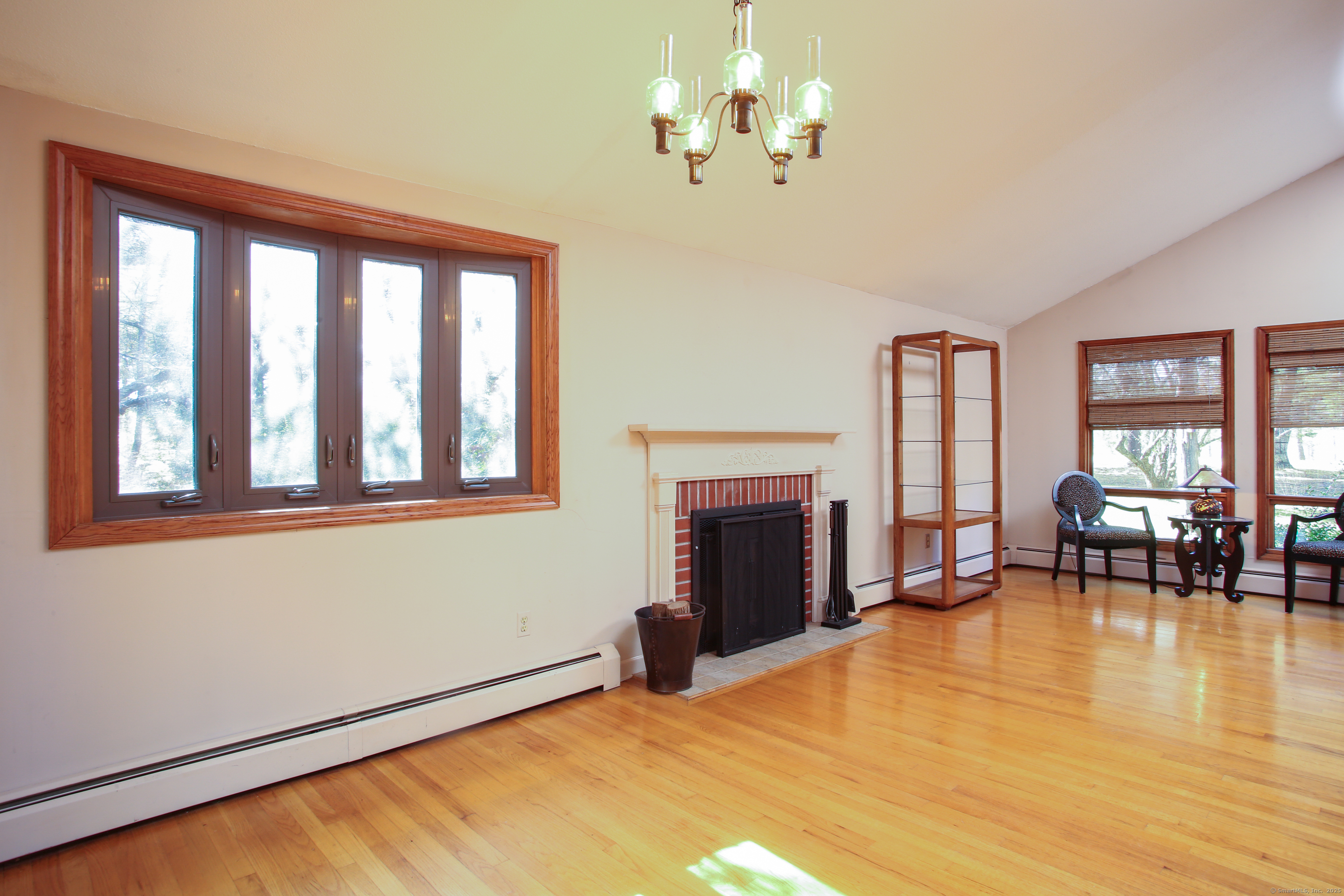 118 Washinee Heights Road Salisbury, CT 06068 - Photo 5 of 31 a bedroom with furniture fireplace and windows