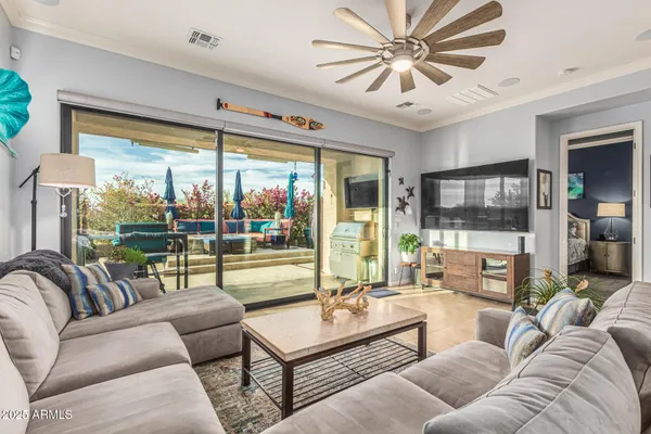 a living room with furniture and a large window