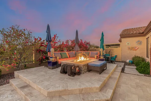 a view of swimming pool with outdoor seating and plants
