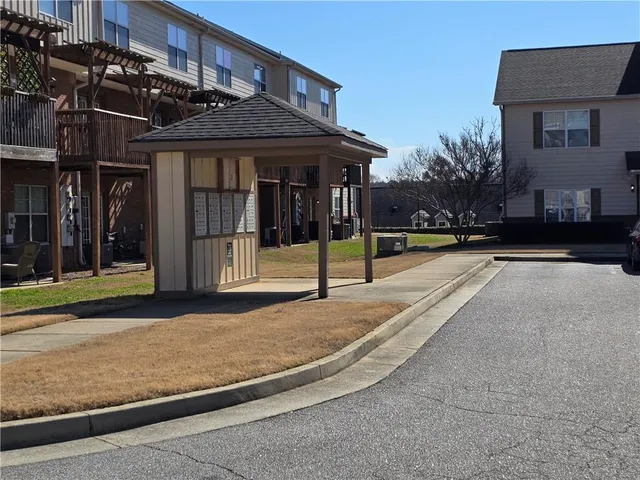 a view of a building with a street