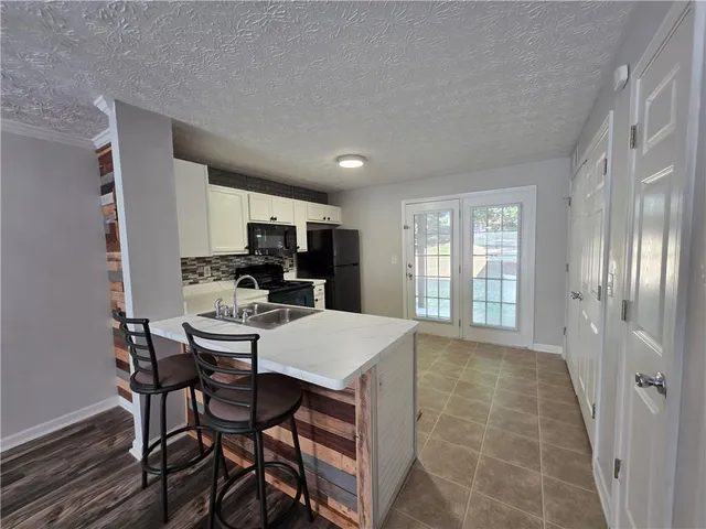 a view of a dining room with furniture and window