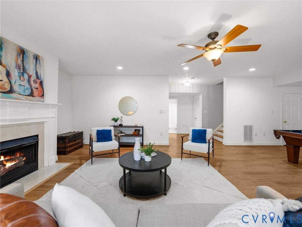 14335 Lander Road Midlothian, VA 23113 - Photo 62 of 70 a living room with furniture and a fireplace
