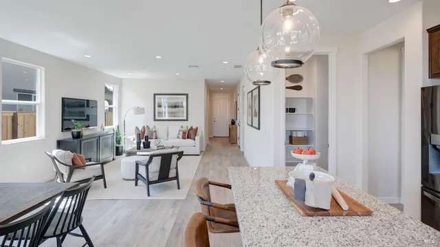 a view of a dining room with furniture and window