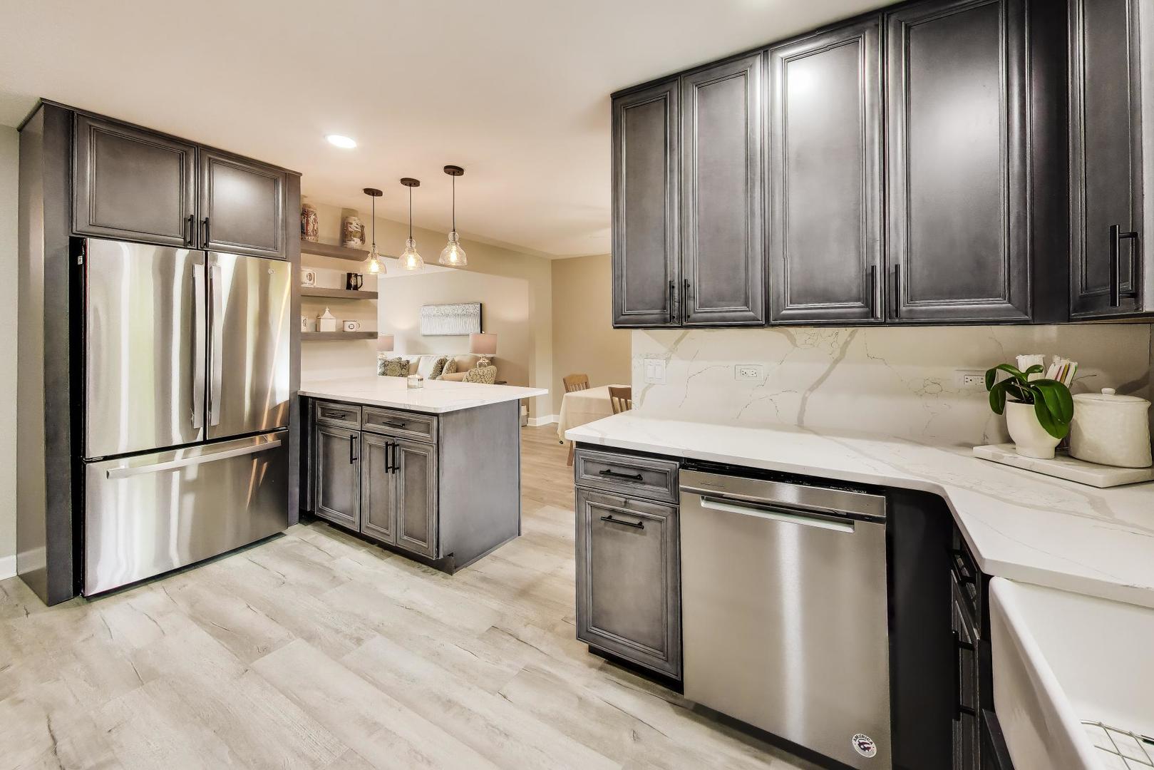 313 South Hi Lusi Avenue Mount Prospect, IL 60056 - Photo 11 of 40 a kitchen with a sink appliances and cabinets