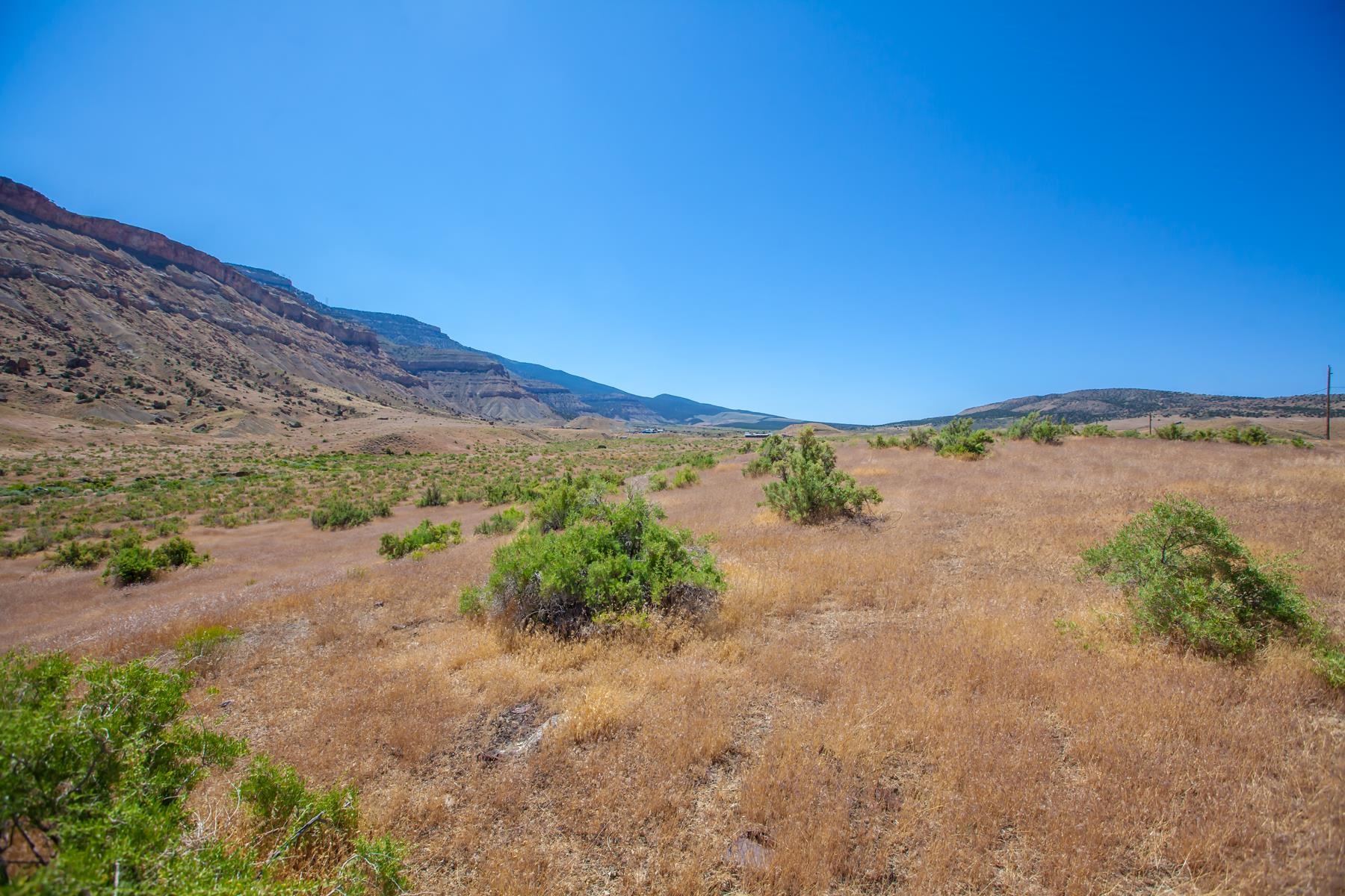 648 39 Road Palisade, CO 81526 - Photo 7 of 23 a view of a lake with mountains in the background