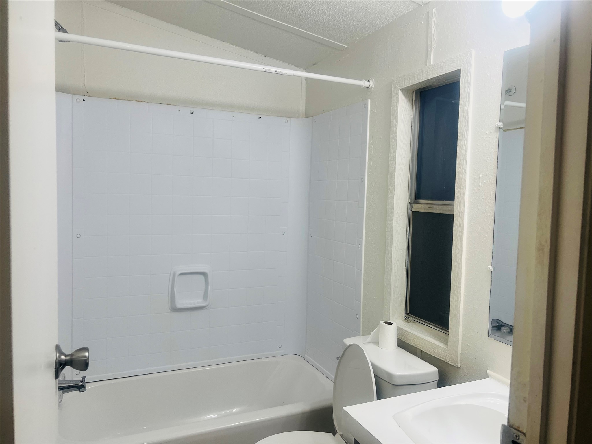 2106 Avenue C Rosenberg, TX 77471 - Photo 15 of 20 a bathroom with a shower and a toilet