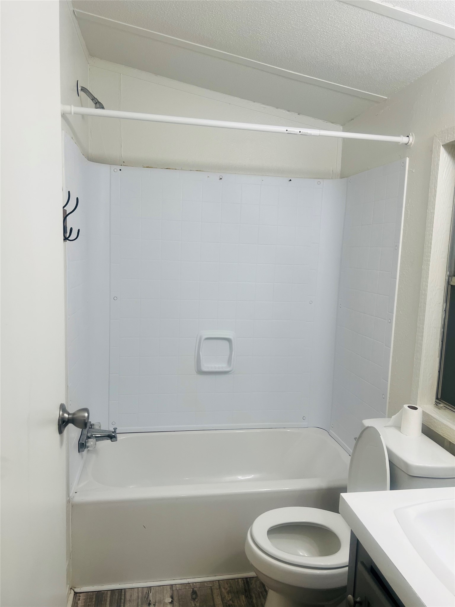 2106 Avenue C Rosenberg, TX 77471 - Photo 16 of 20 a bathroom with a toilet and a bathtub