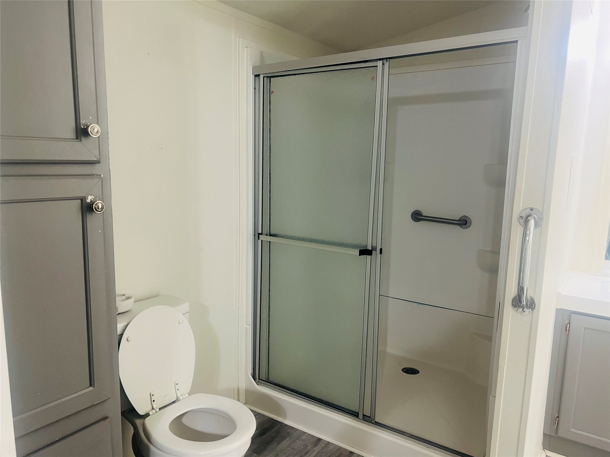 2106 Avenue C Rosenberg, TX 77471 - Photo 18 of 20 a bathroom with a toilet and a shower