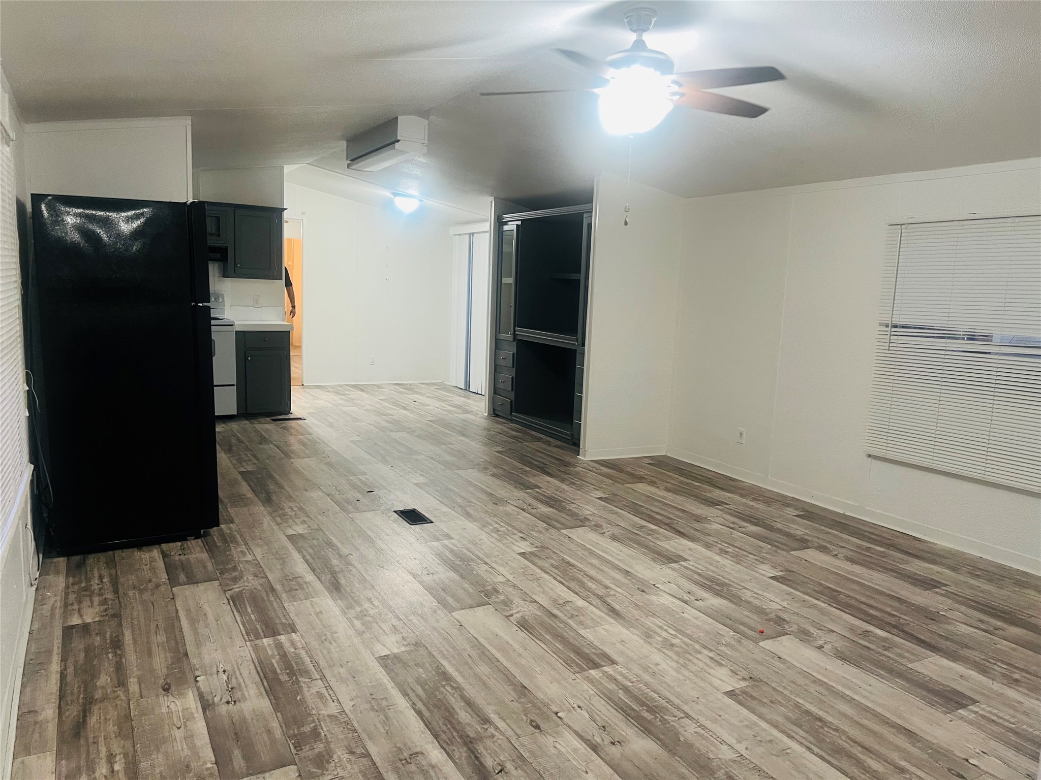 2106 Avenue C Rosenberg, TX 77471 - Photo 4 of 20 a view of a hallway with wooden floor