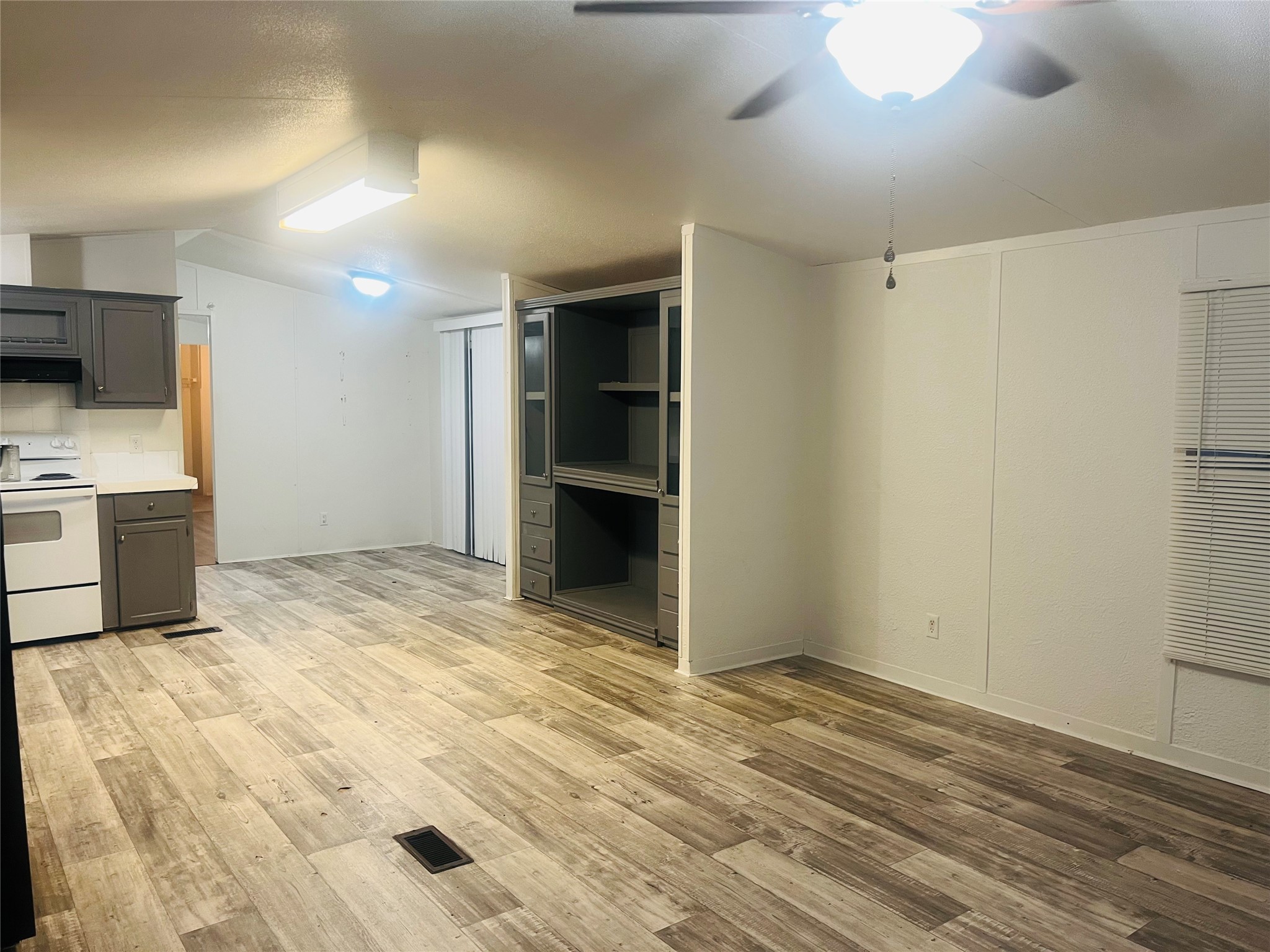 2106 Avenue C Rosenberg, TX 77471 - Photo 10 of 20 a view of an empty room with kitchen and a window