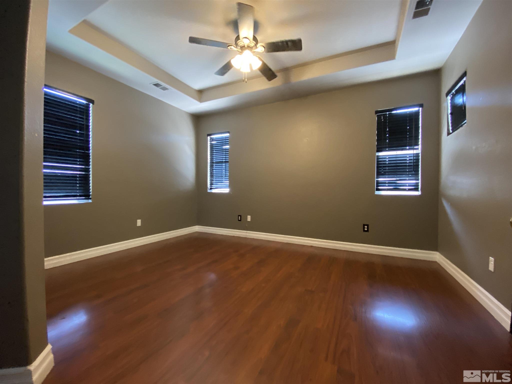 9636 Truckee Meadows Place Reno, NV 89521 - Photo 13 of 21 a view of an empty room with window and chandelier fan