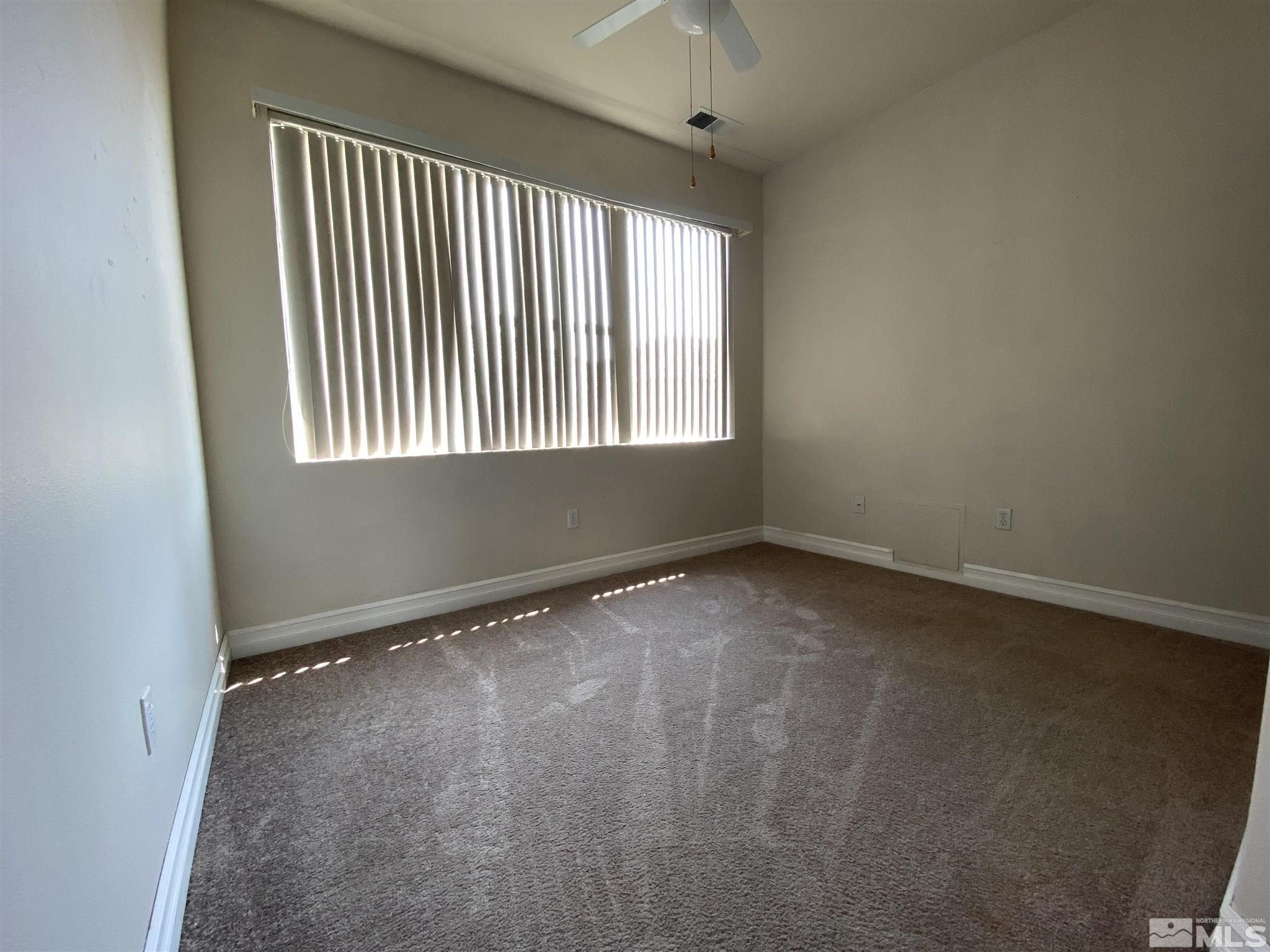 9636 Truckee Meadows Place Reno, NV 89521 - Photo 16 of 21 an empty room with a window